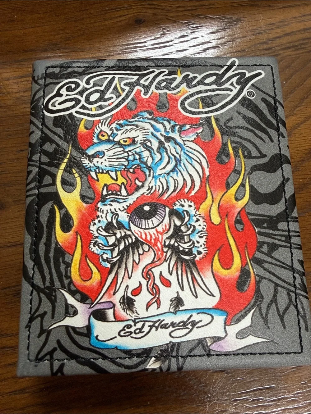 Ed Hardy Black Wallet with Fierce Tiger Artwork. Multiple card slots. ID window.